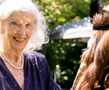 Resident dancing at great gatsby event at Birchwood House