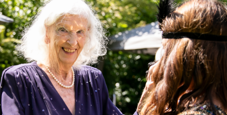 Resident dancing at great gatsby event at Birchwood House